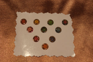 Bindis are coloured dots worn on the centre of a woman's forehead they come in various designs and shapes.   A card of bindis come in different colours and are reusable. To reuse the adhesive after it is worn off, we recommend the use of eyelash glue for application. 